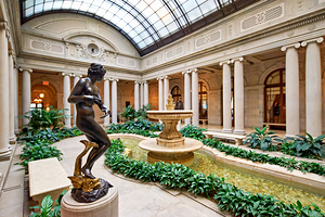 Visitors explore the courtyard at the Frick Collection in Manhat