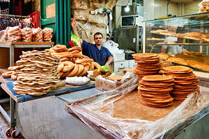 Baker working in the souq of Old City Jerusalem during the day