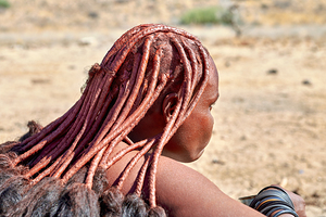 Portrait of Himba woman with traditional headdress in Namibia