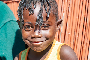 Joyful child smiles in Kavango Region of Namibia