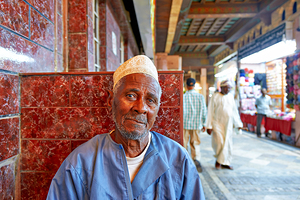 Elderly man resting at the Mutrah Souq in Muscat Oman