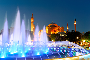 Hagia Sophia Grand Mosque at night with a fountain display