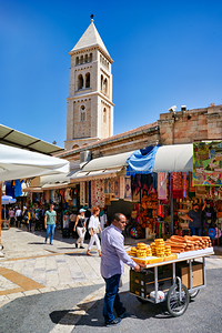 Selling bread in the old city of Jerusalem during a sunny day