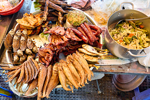 Delicious array of cooked fish sausages and stir fry.