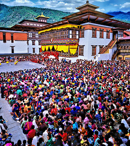 Large crowd at a traditional Bhutanese festival.