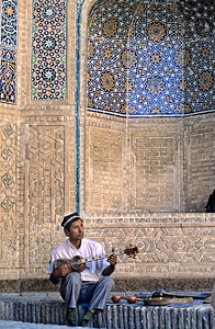 Musician plays traditional instrument in Bukhara Uzbekistan