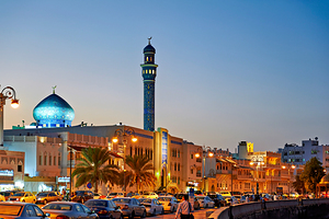 Waterfront cityscape of Muscat Oman at dusk
