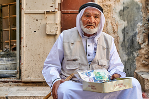 Old man sitting with sweets in Jerusalems old city