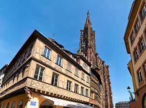 People walk by Kammerzell House near Strasbourg Cathedral in Als