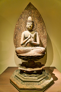 Sculpture of buddha in asian art gallery in metropolitan museum 