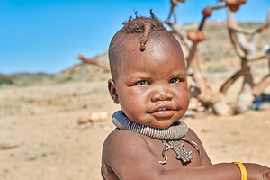 Portrait of Himba child in Kunene region of Namibia