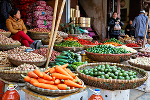 Market scene in Hanoi with fresh vegetables and people