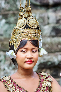 Traditional Cambodian dancer in ornate golden headdress.