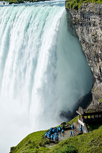 Tourists in blue ponchos at Niagara Falls.