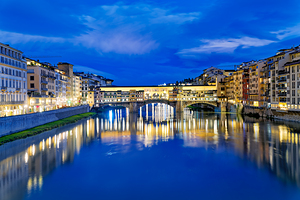 Ponte Vecchio bridge over the Arno river in Florence at night