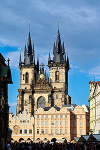 Pragues Týn Church towers over Old Town Square crowd.