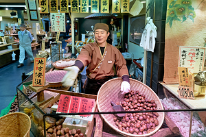 Chestnut seller at Nishiki Market in Kyoto Japan during the day