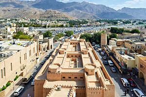 Cityscape view of Nizwa Oman with mountains and buildings