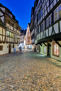 Historic timber framed houses in Petit France district at dusk