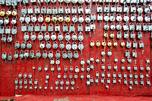 Lockers displayed on a red wall in Bundi market Rajasthan Indi
