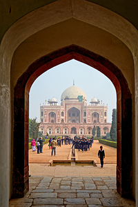Visitors walking towards Humayuns Tomb in Delhi during the day