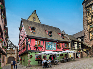 Timber framed houses and outdoor dining in Riquewihr Alsace