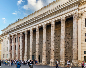 Exploring the Temple of Hadrian in Rome during a sunny day