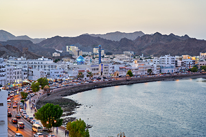 Waterfront cityscape view of Muscat Oman at dusk
