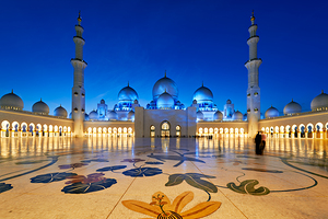 Visitors admire the beauty of Sheikh Zayed Grand Mosque at night