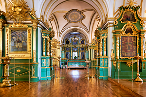 Visitors walk through the grand interior of St