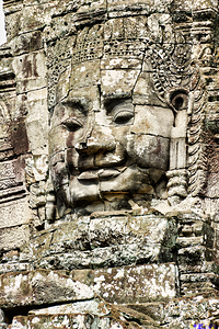 Serene stone face carving Bayon temple Angkor.