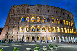 Visit Colosseum in Rome Lazio Italy at night with bright lights