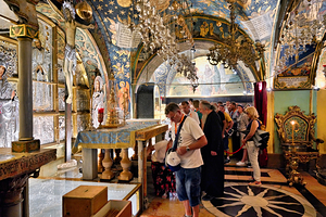 Visitors explore the church of the Holy Sepulchre in Jerusalem
