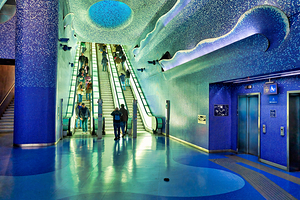 Toledo station of Naples Metro with blue tiles and escalators