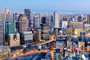 Osaka business district at dusk with city lights and buildings