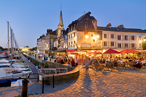 Harbour in Honfleur Normandy France during dusk with visible lig