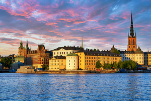 Sunset view of Riddarholm Church and the old town in Stockholm by Marco Brivio