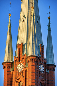 Klara Church in central Stockholm with tall spires and clock by Marco Brivio