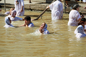 Visitors participate in baptism ceremonies at the Jordan River