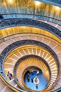 Visitors descend the Bramante staircase in Vatican City