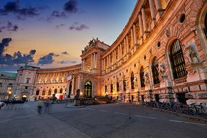Hofburg Palace Vienna illuminated at dusk.