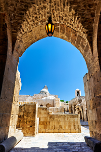 View of the citadel in Aleppo and the sky above from an archway by Marco Brivio