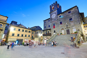 Cortona Tuscany at sunset with Palazzo del Popolo in view by Marco Brivio