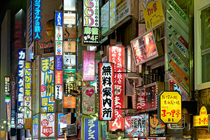 Neon lights illuminate Shinjuku district in Tokyo at night