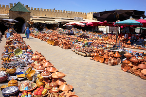 Pottery market scene in Meknes Morocco shows vibrant goods for s