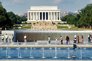 Visitors walk around the National World War II Memorial