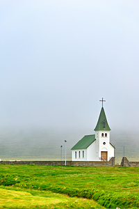 Visit tjarnarkirkja church in Iceland on a foggy day