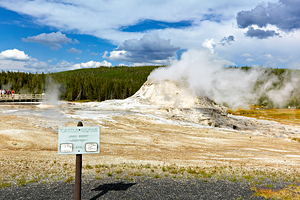 Castle Geyser erupts steam in Yellowstone National Park