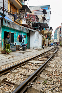 Locals near train tracks in Ho Chi Minh City Vietnam