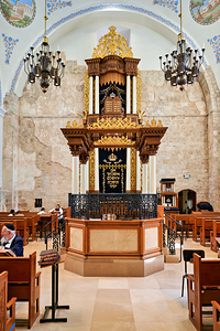 Hurva Synagogue in Jerusalem with visitors and a Torah Ark